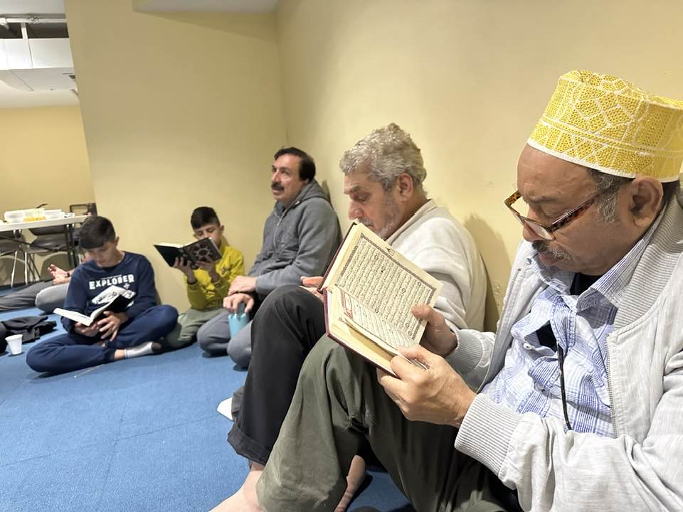 Community members in Qur’an study at the Islamic Center of Louisville
